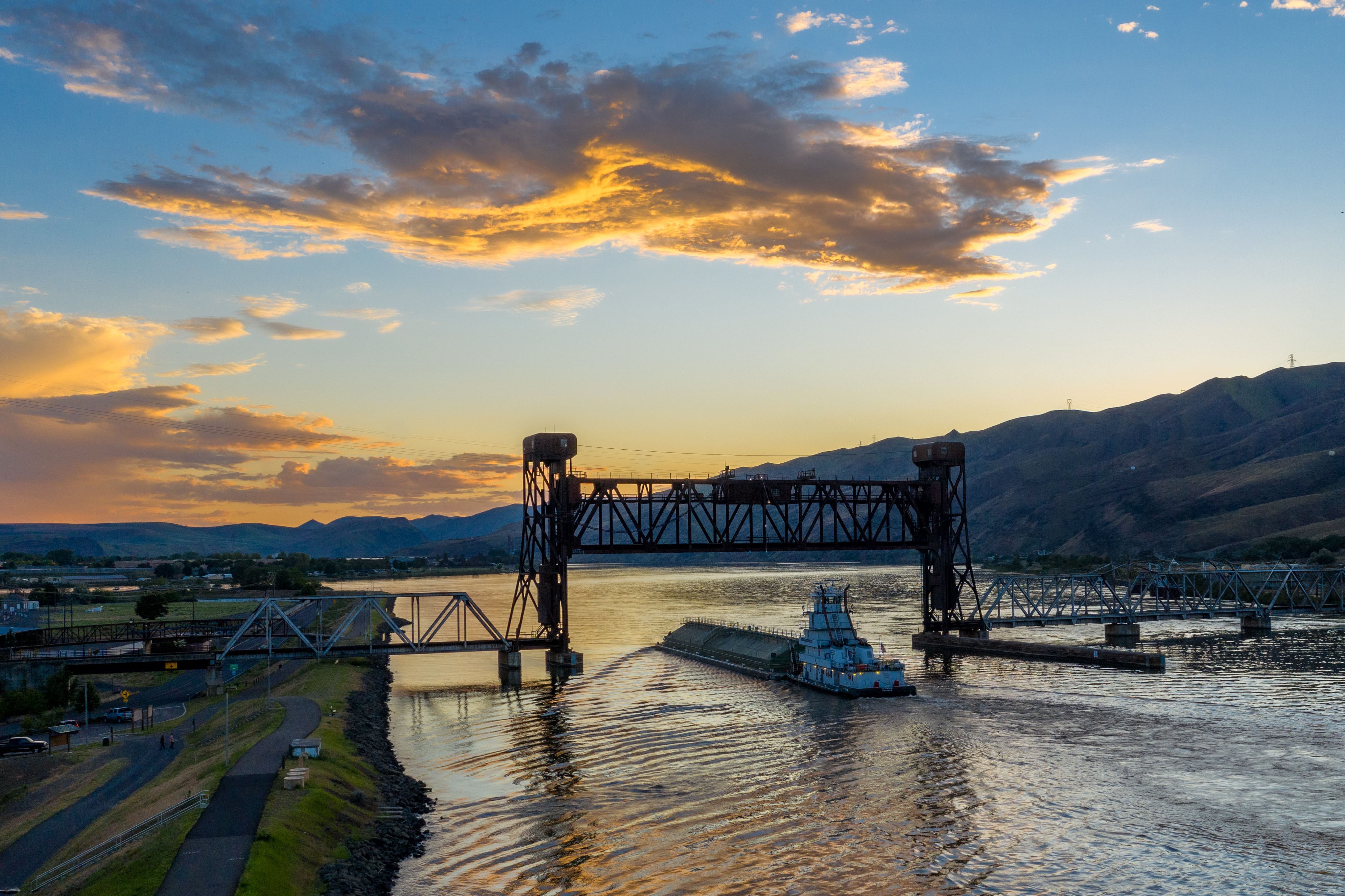 Golden sunset over the Clearwater River and railroad bridge in Lewiston, Idaho
